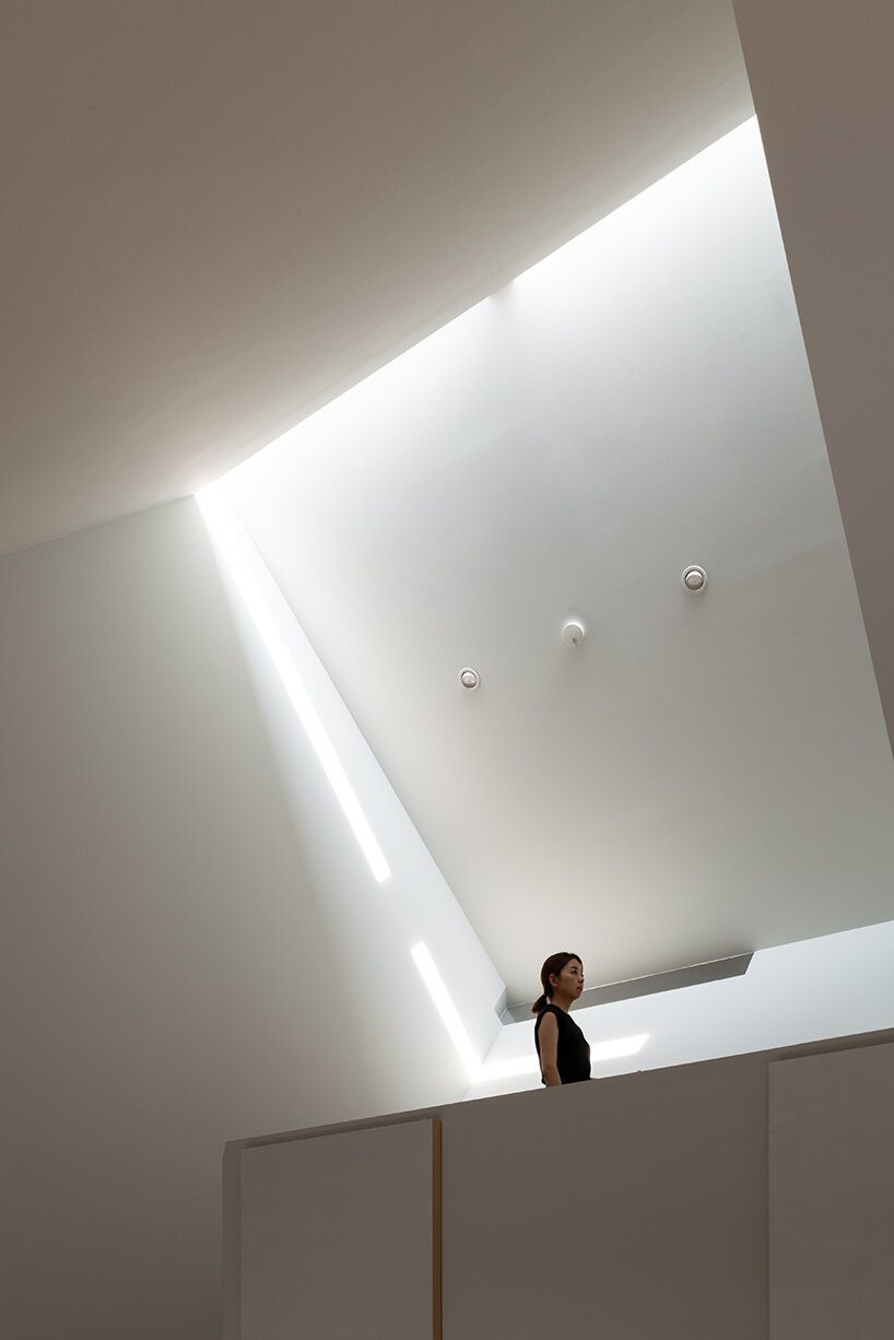 metallic steel sheets clad residence by MASA architects, reflecting the changing sky in japan