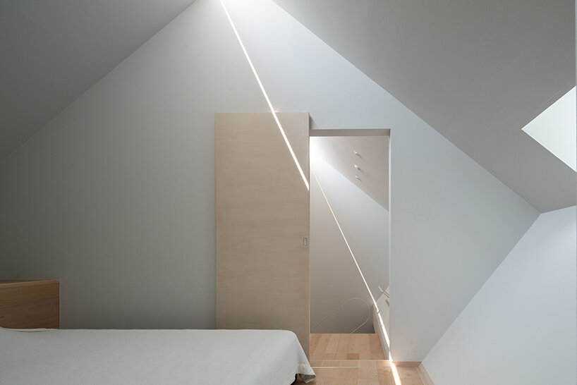 metallic steel sheets clad residence by MASA architects, reflecting the changing sky in japan