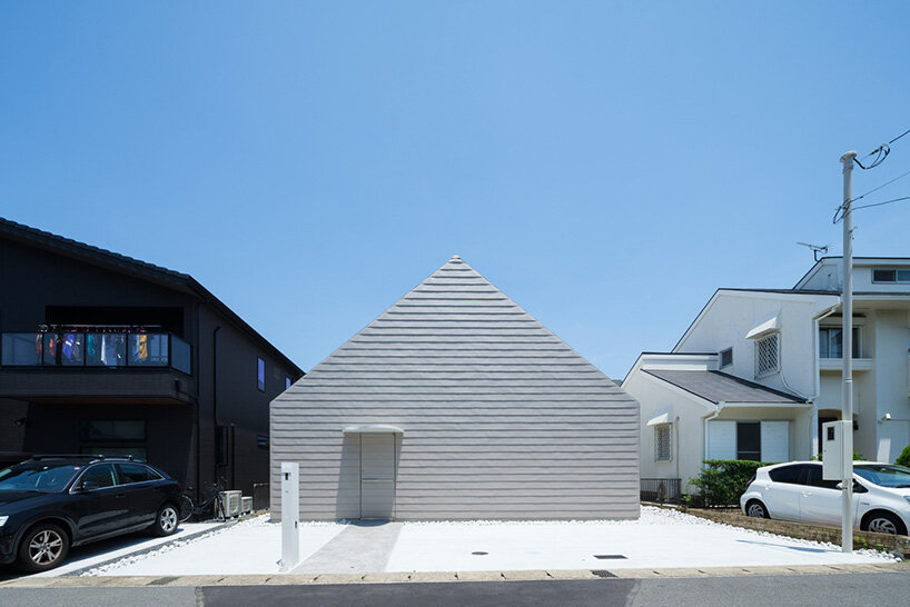metallic steel sheets clad residence by MASA architects, reflecting the changing sky in japan