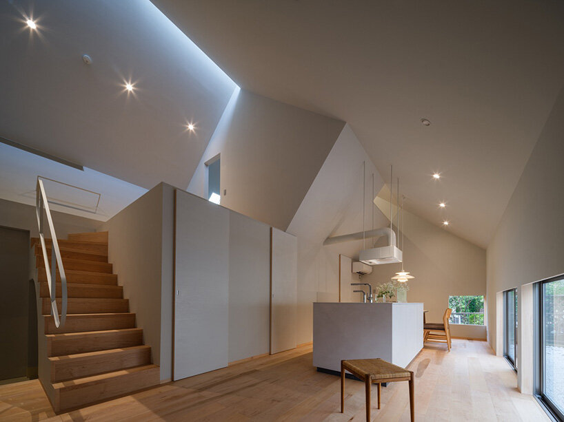 metallic steel sheets clad residence by MASA architects, reflecting the changing sky in japan